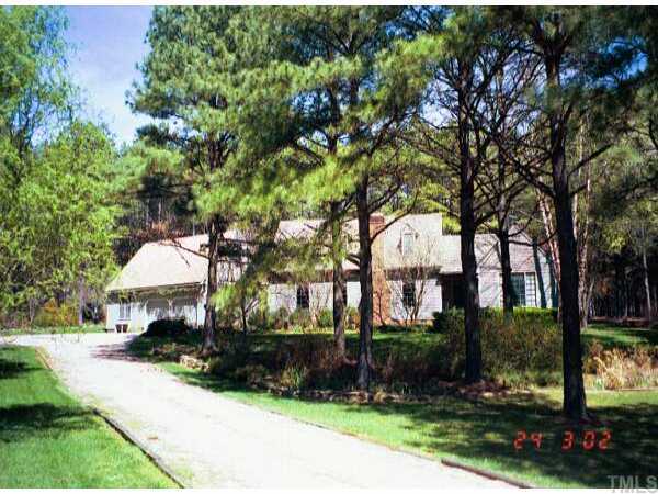 13600 Durant Road Raleigh, NC 27614 - Photo 1 of 1 a front view of a house with a yard and tree