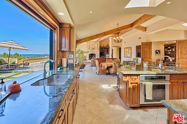 a very nice looking kitchen with a large window