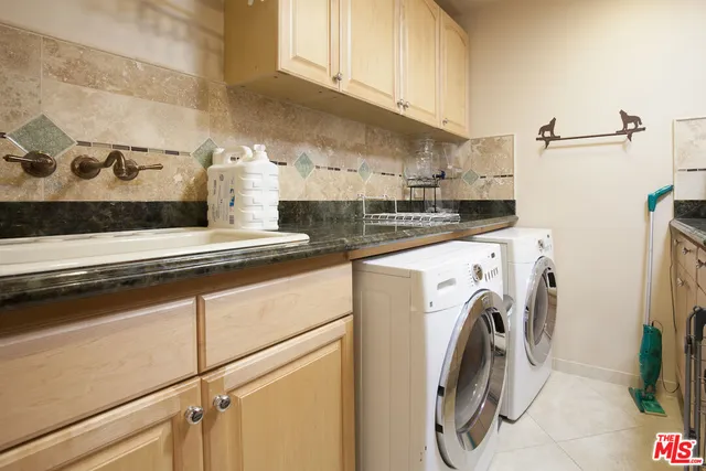 a view of a kitchen with washer and dryer