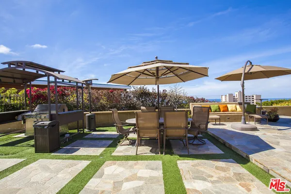 a view of a terrace with furniture