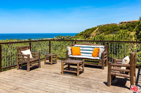 a view of a terrace with chairs