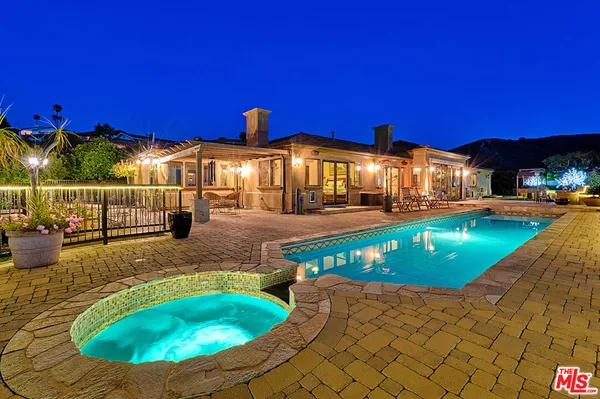 a view of a house with swimming pool