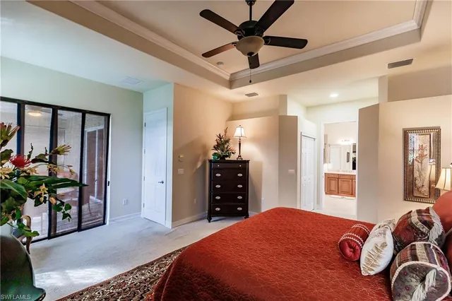 a bedroom with a bed dresser and a window