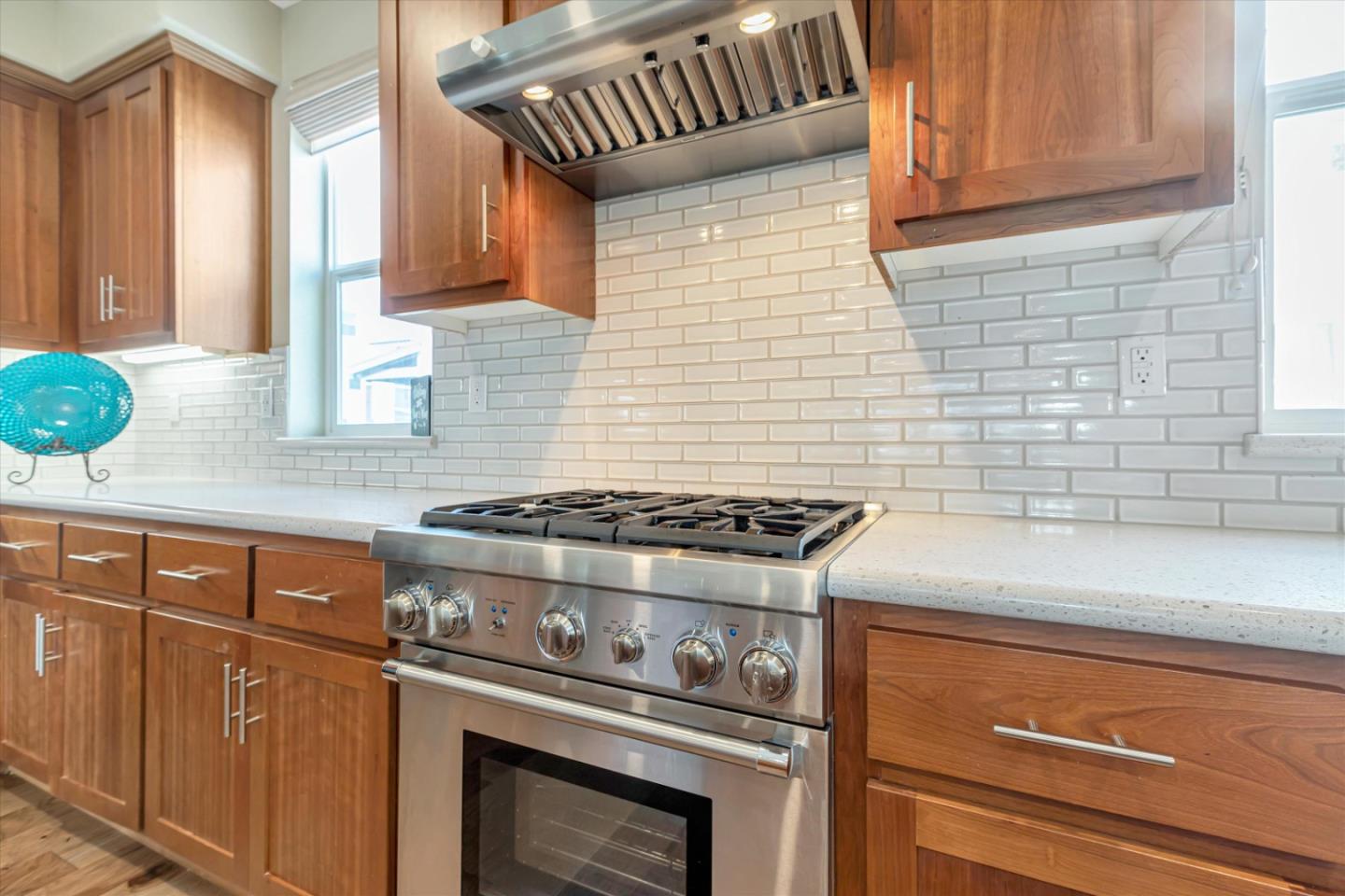 1480 Bond Street Milpitas, CA 95035 - Photo 12 of 51 a stove top oven sitting inside of a kitchen