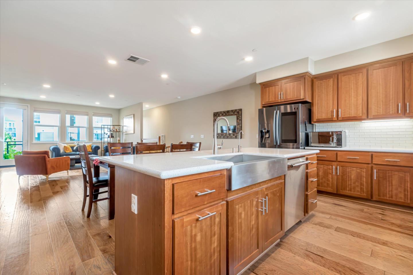 1480 Bond Street Milpitas, CA 95035 - Photo 14 of 51 a kitchen with stainless steel appliances granite countertop a stove top oven a refrigerator a sink and dishwasher with wooden floor