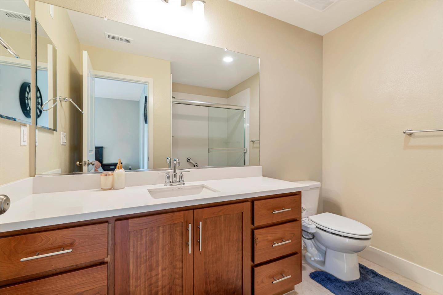 1480 Bond Street Milpitas, CA 95035 - Photo 20 of 51 a bathroom with a sink a toilet a mirror and vanity