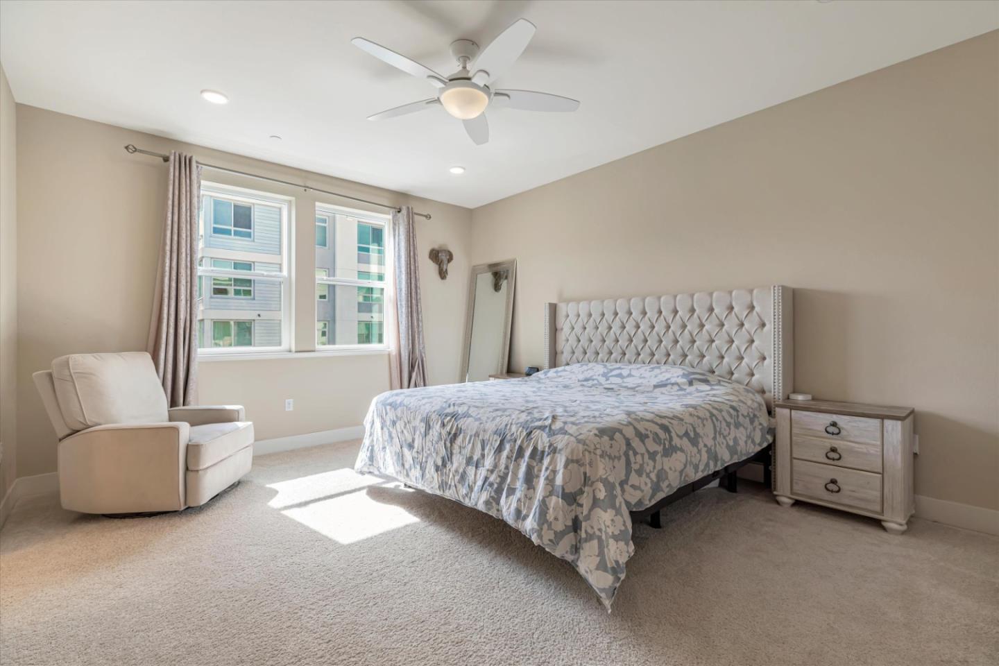 1480 Bond Street Milpitas, CA 95035 - Photo 21 of 51 a spacious bedroom with a bed and a couch