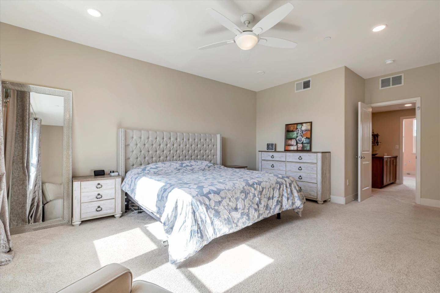 1480 Bond Street Milpitas, CA 95035 - Photo 22 of 51 a bedroom with a bed and a chandelier