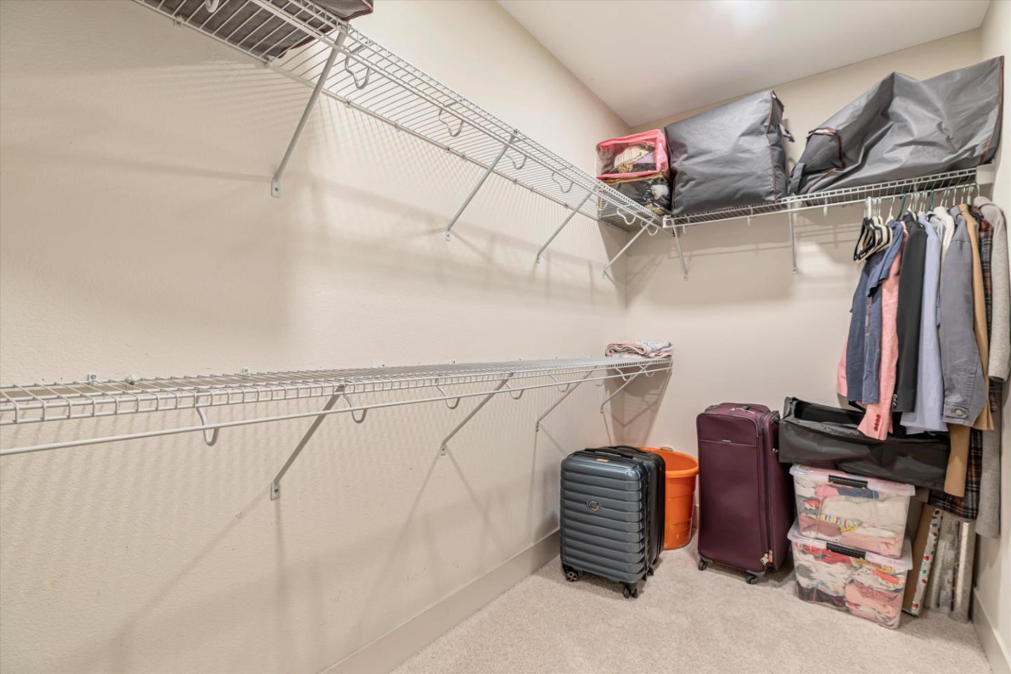 1480 Bond Street Milpitas, CA 95035 - Photo 23 of 51 a view of walk in closet with clothes and shoes