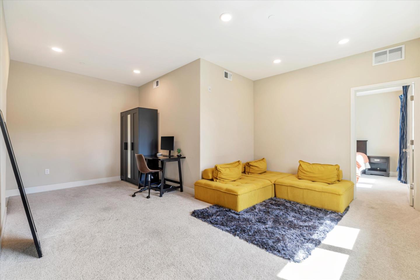 1480 Bond Street Milpitas, CA 95035 - Photo 4 of 51 a living room with a couch and a walk in closet