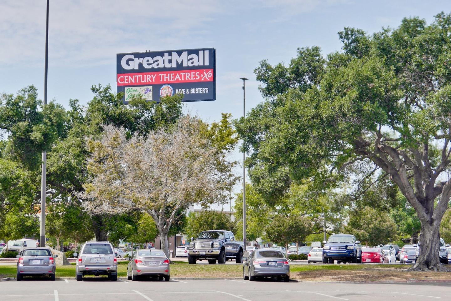 1480 Bond Street Milpitas, CA 95035 - Photo 48 of 51 a view of road with card parked on side and retail shops