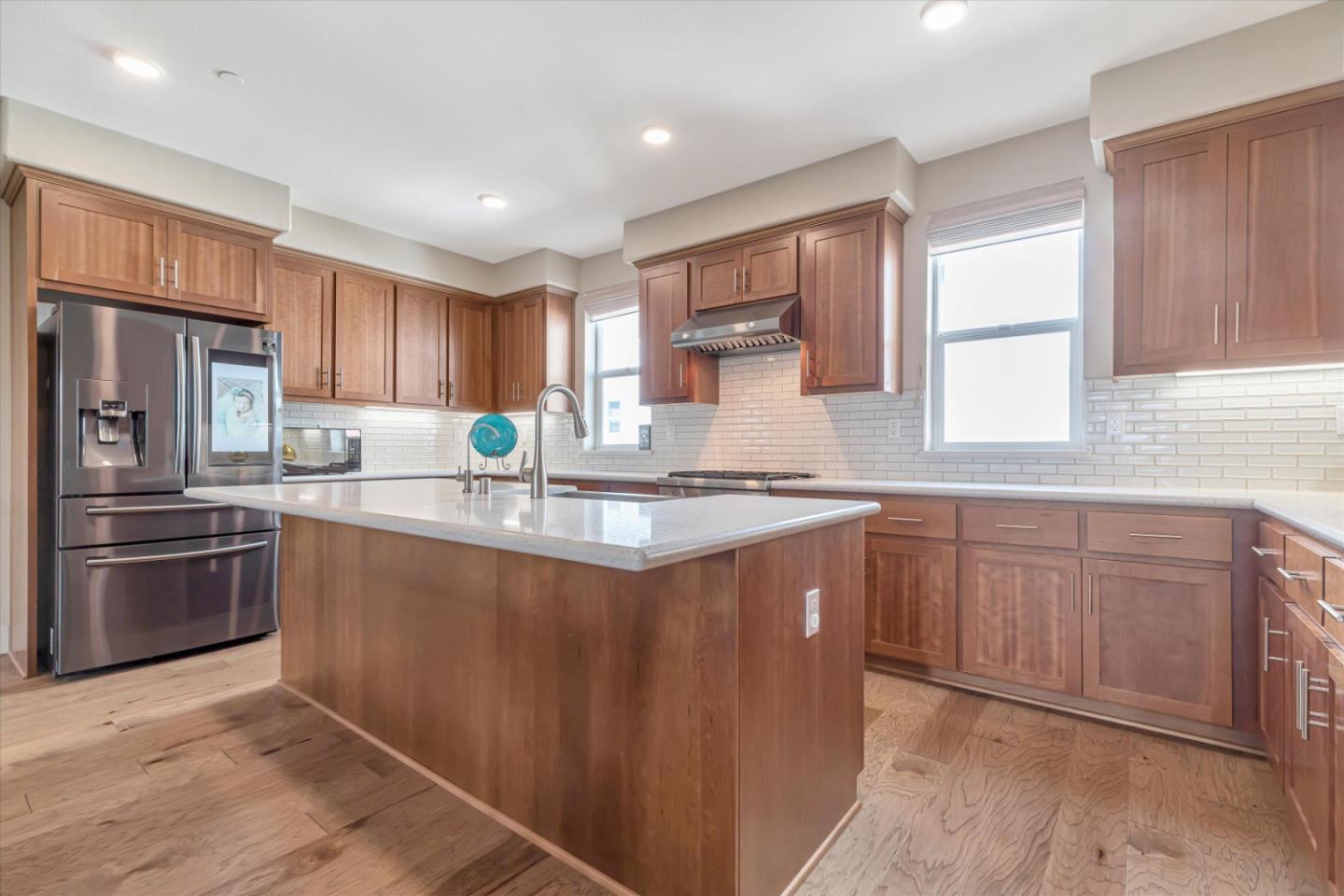 1480 Bond Street Milpitas, CA 95035 - Photo 10 of 51 a kitchen with stainless steel appliances granite countertop a sink stove and refrigerator
