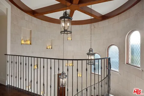 a front view of a house with garden and patio