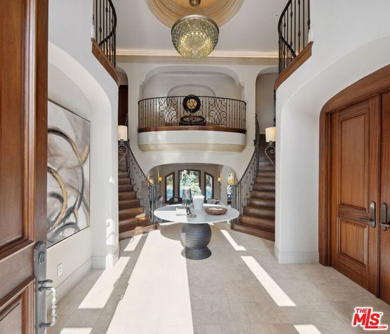 a living room with furniture and a painting