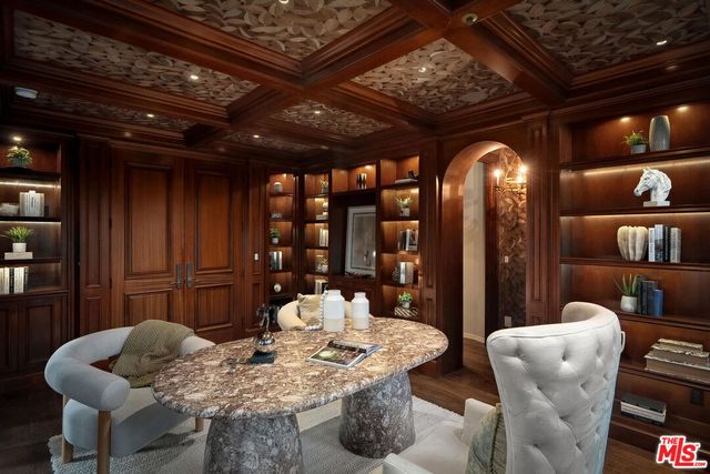 a kitchen with a table and chairs in it