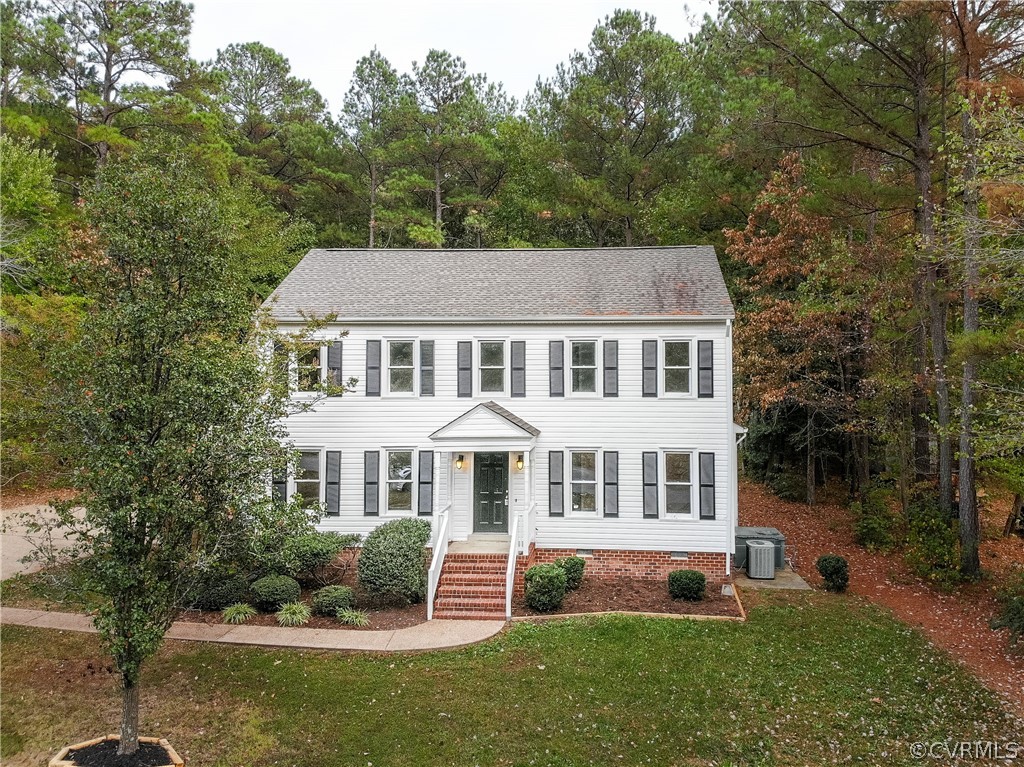 3561 Markey Road Midlothian, VA 23112 - Photo 1 of 48 a front view of a house with a yard and trees