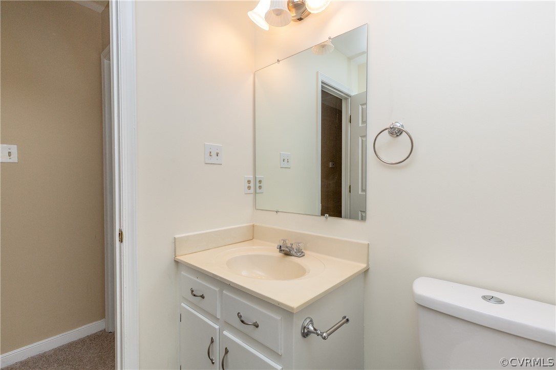 3561 Markey Road Midlothian, VA 23112 - Photo 30 of 48 a bathroom with a sink a toilet and a mirror