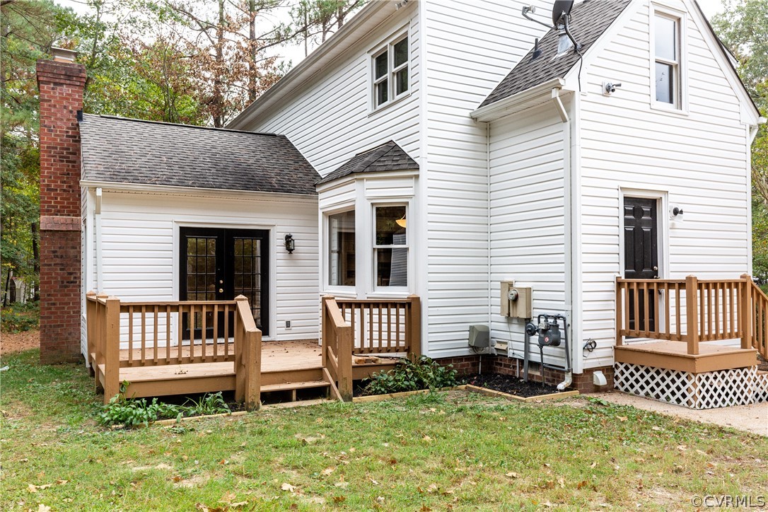 3561 Markey Road Midlothian, VA 23112 - Photo 44 of 48 a view of a house with a wooden deck and a yard
