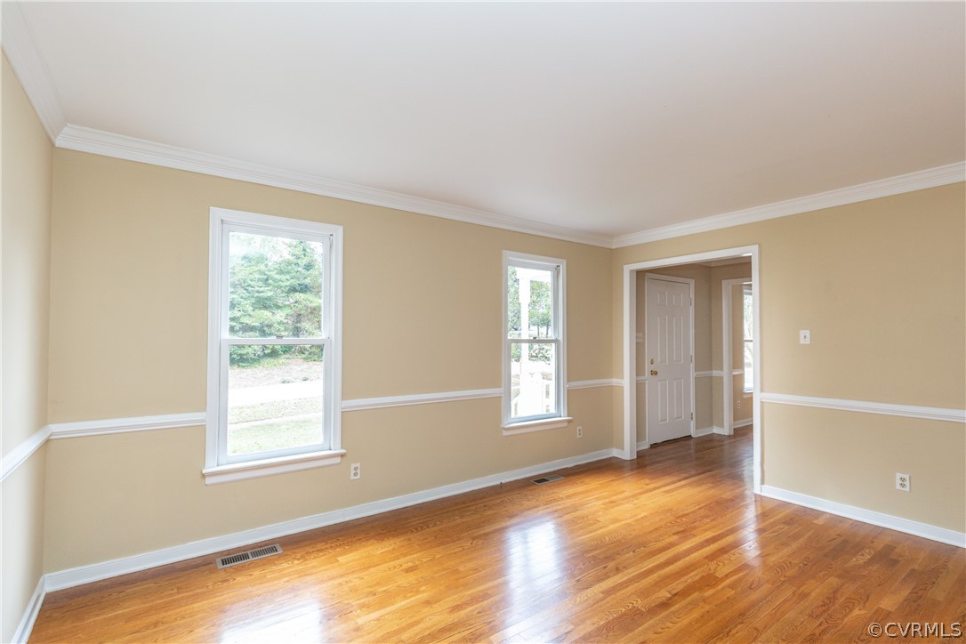 3561 Markey Road Midlothian, VA 23112 - Photo 7 of 48 a view of an empty room with wooden floor and a window