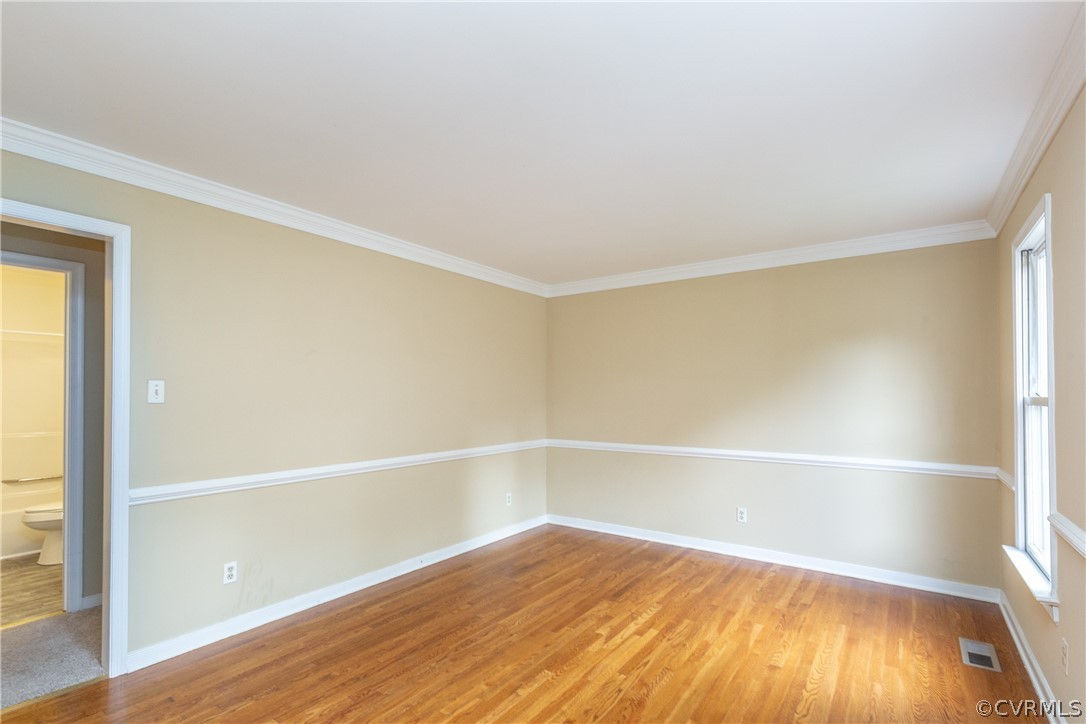 3561 Markey Road Midlothian, VA 23112 - Photo 8 of 48 a view of an empty room with wooden floor and a window