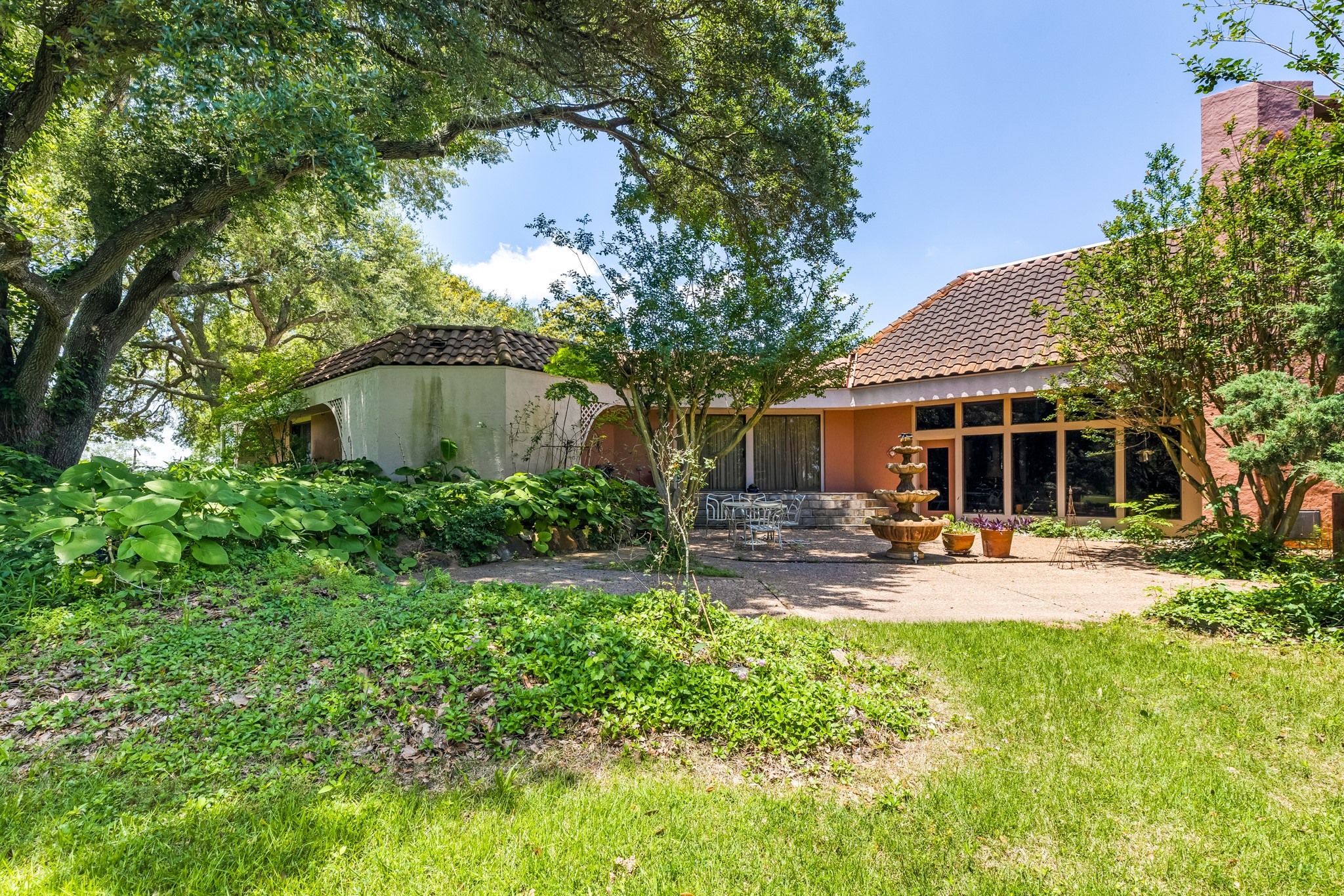 2009 FM 950 Road Eagle Lake, TX 77434 - Photo 22 of 27 a view of a house with backyard sitting area and garden