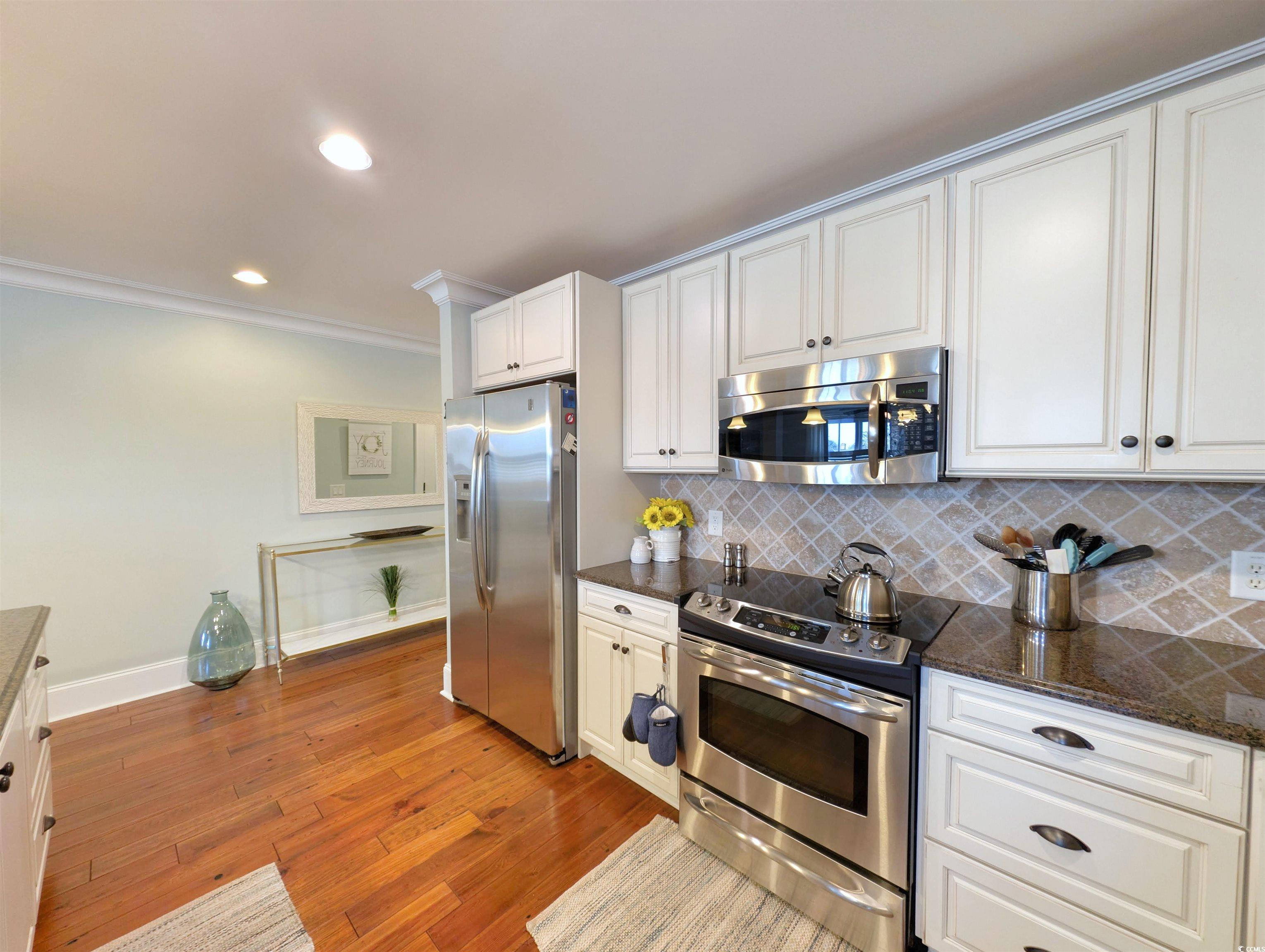 815 Front Street, Unit 3J Georgetown, SC 29440 - Photo 6 of 39 Kitchen featuring ornamental molding, stainless st