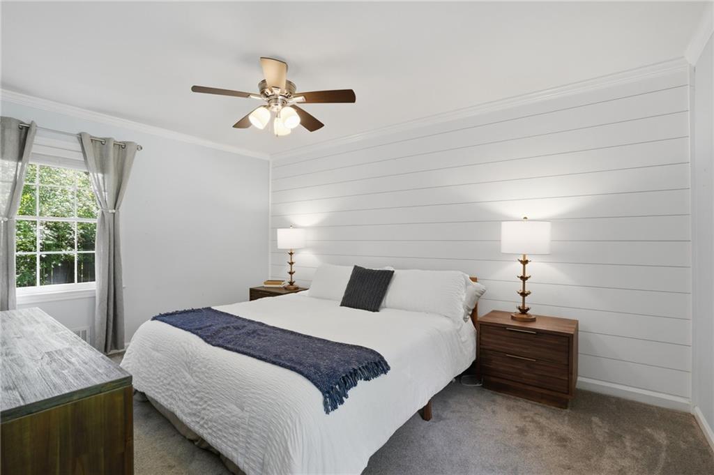 4000 Lower Roswell Road Marietta, GA 30068 - Photo 16 of 25 a bedroom with a bed and a chandelier