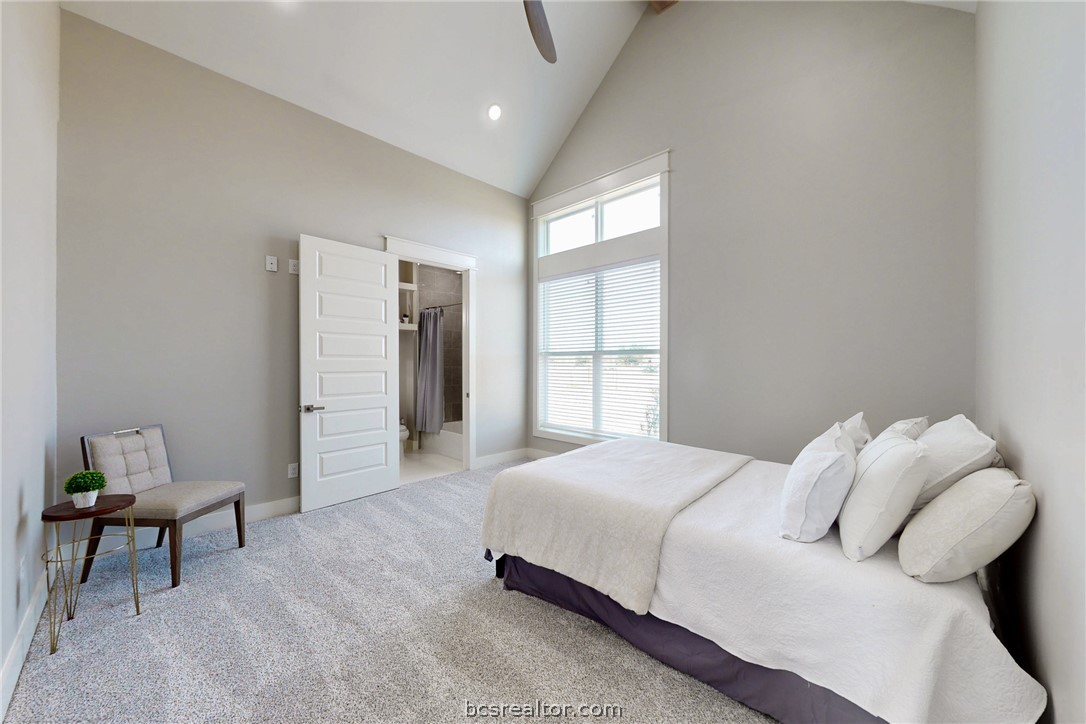 13504 Hudson Farms Road Hearne, TX 77859 - Photo 16 of 48 Each bedroom has a beautiful ceiling line and big windows with lots of light. Custom paint, 2 inch faux wood blinds, ceiling fan and a big walk in closet. This one has it's own personal bathroom.