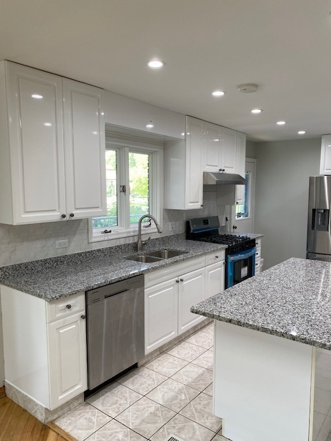 7037 West Main Street Niles, IL 60714 - Photo 8 of 29 a kitchen with granite countertop sink stainless steel appliances and window