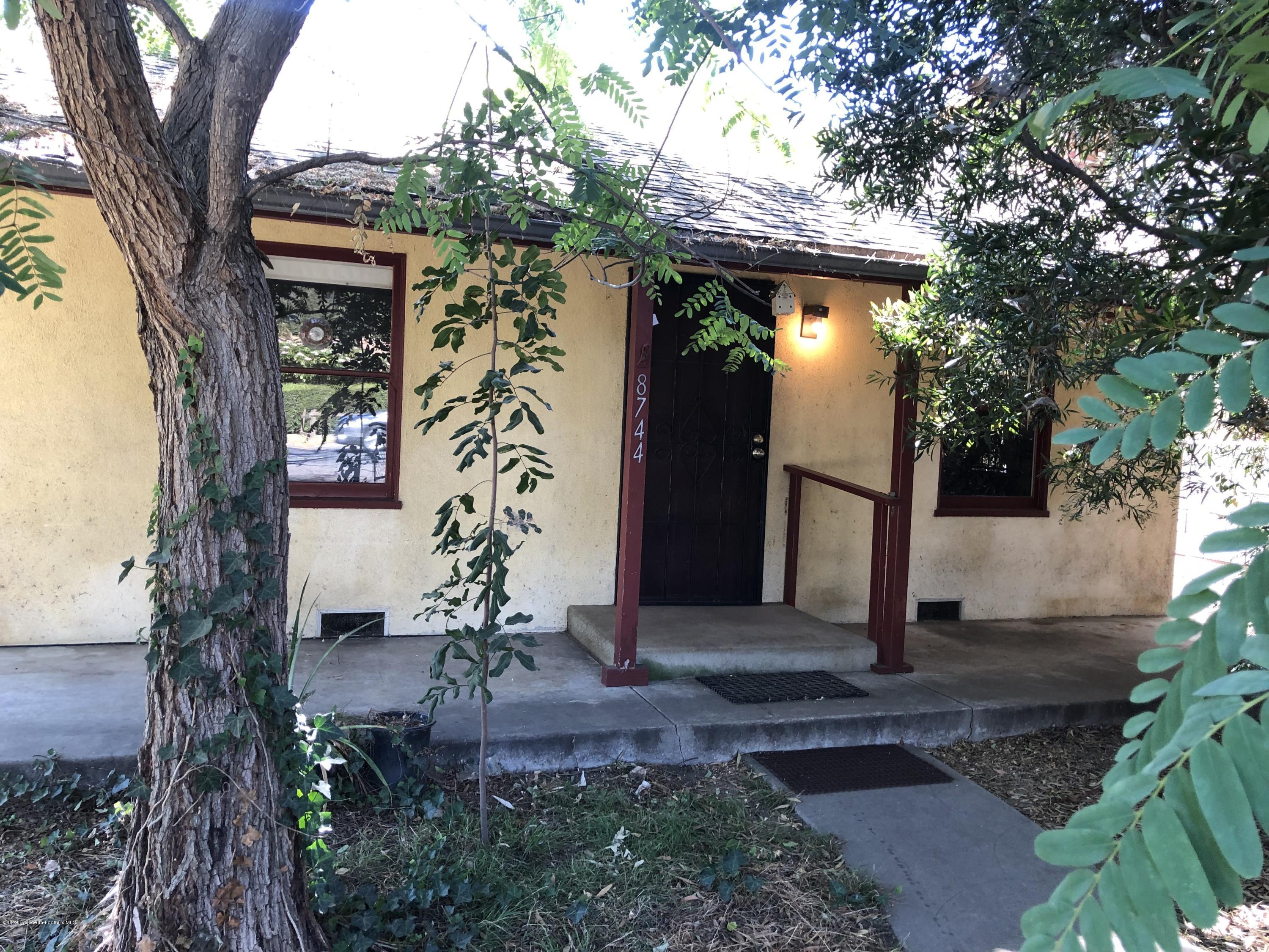 8744 Duarte Road San Gabriel, CA 91775 - Photo 1 of 16 a front view of a house with garden