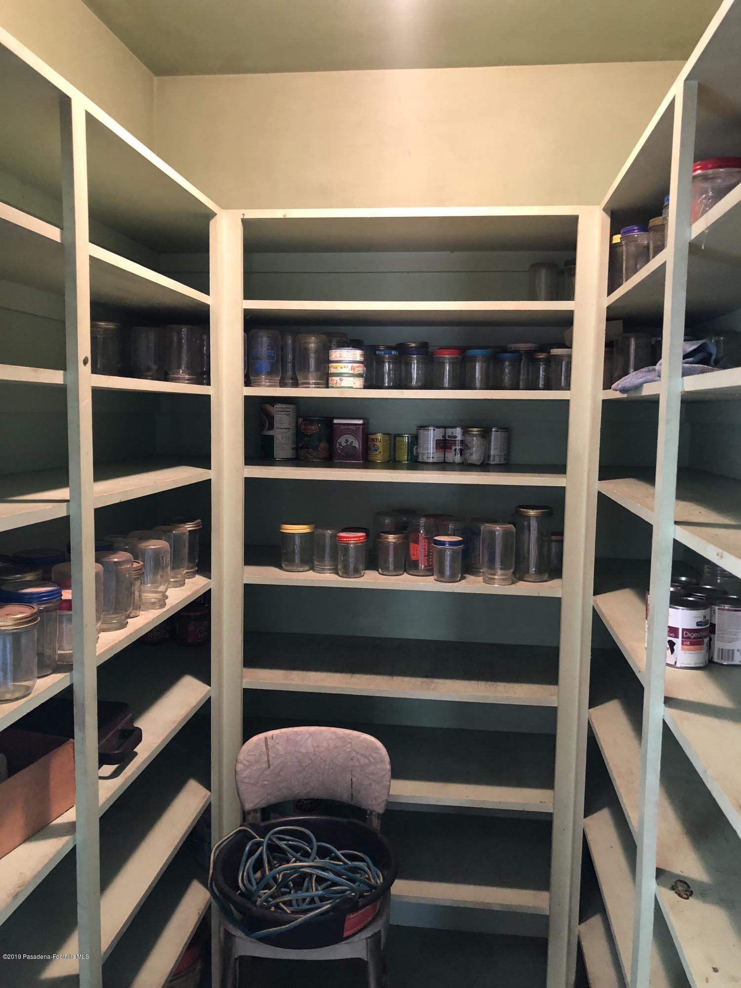 8744 Duarte Road San Gabriel, CA 91775 - Photo 6 of 16 a view of walk in closet with clothes and shoes