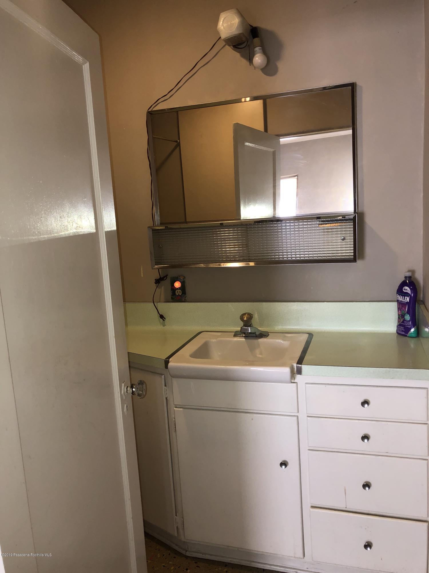 8744 Duarte Road San Gabriel, CA 91775 - Photo 8 of 16 a bathroom with a sink and a mirror