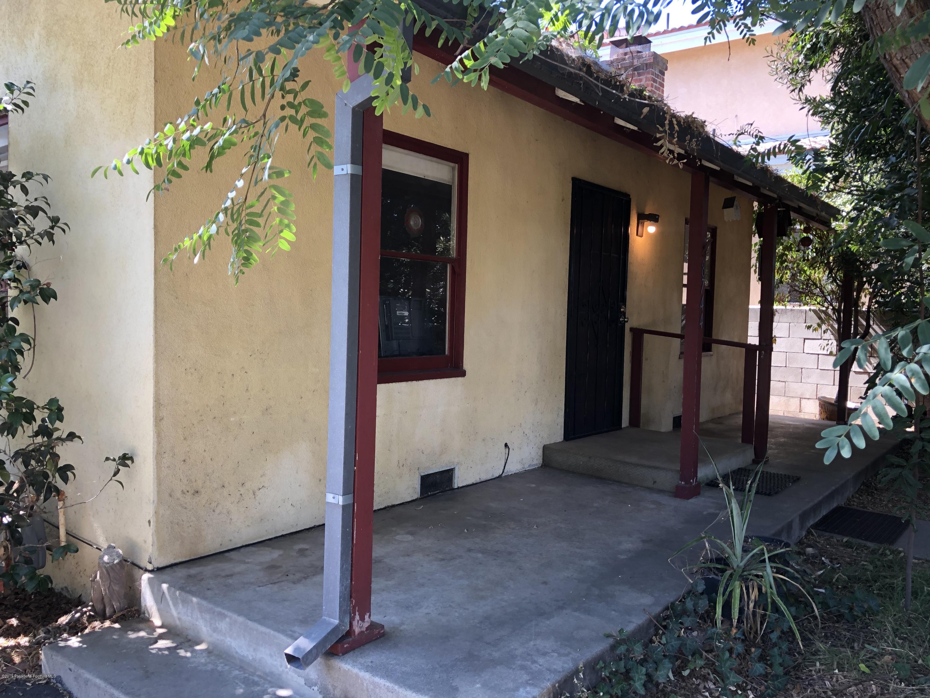 8744 Duarte Road San Gabriel, CA 91775 - Photo 10 of 16 a backyard of a house with potted plants and large tree