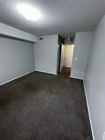 an empty room with a fireplace