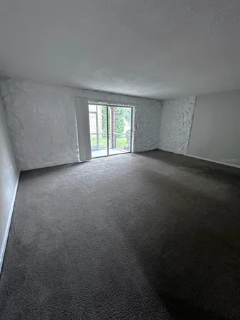 a view of empty room with windows