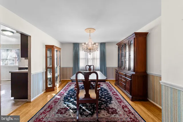 a living room with furniture rug and window