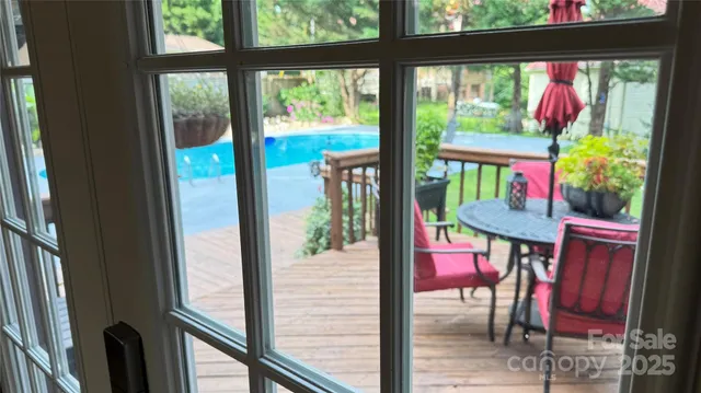 a view of swimming pool with seating area