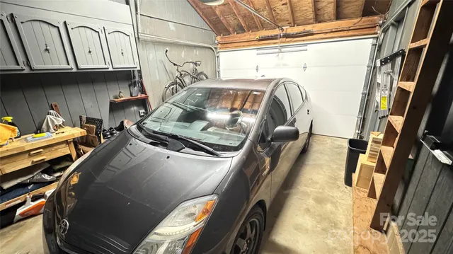 a view of living room kitchen with furniture and stove