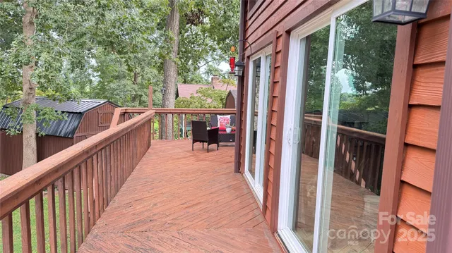 a view of a house with swimming pool and sitting area