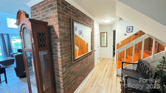 a large bathroom with double vanity sink a two mirror a window and a shower