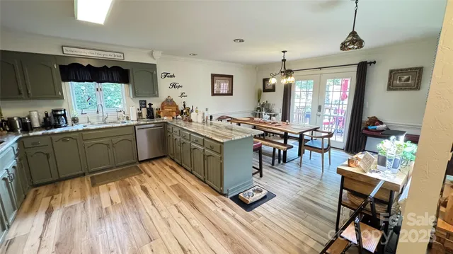 a living room with furniture fireplace and a large window