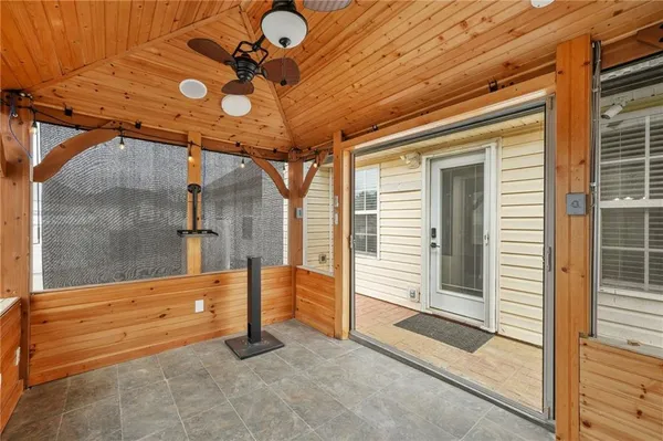 a view of a room with wooden floor