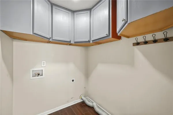 a view of a backyard with a garden and entertaining space