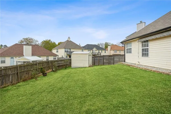 a house view with a garden space