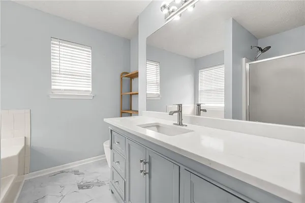a bathroom with a sink a vanity and a mirror