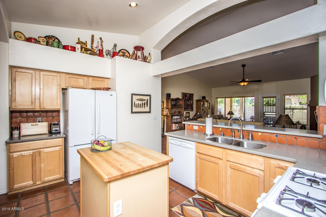 923 East Redfield Road Phoenix, AZ 85022 - Photo 10 of 42 a kitchen with a refrigerator and countertop
