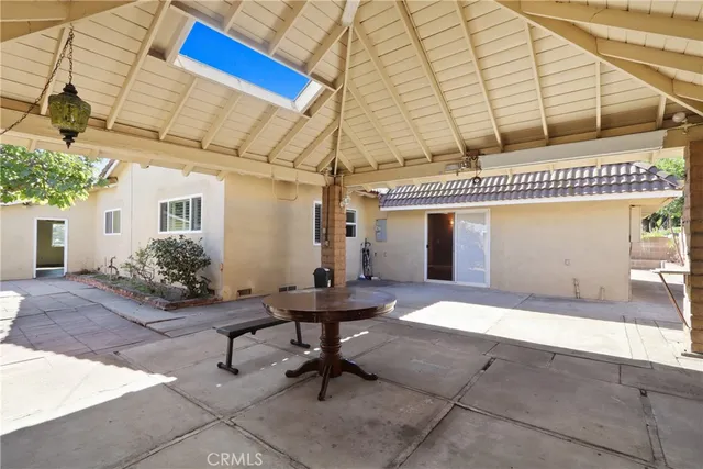 a view of a dinning room with table and chairs