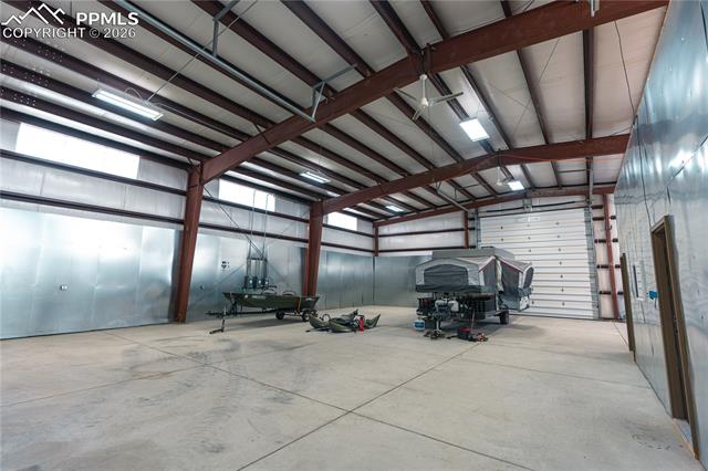 940 Puma Hills Road Lake George, CO 80827 - Photo 25 of 42 Spacious interior with concrete flooring and exposed metal beam construction