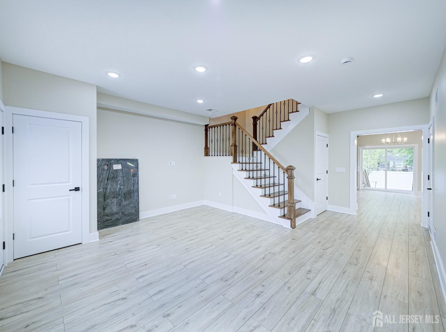 8 Travers Avenue, Unit 1 Edison, NJ 08817 - Photo 7 of 19 a view of an entryway with wooden floor