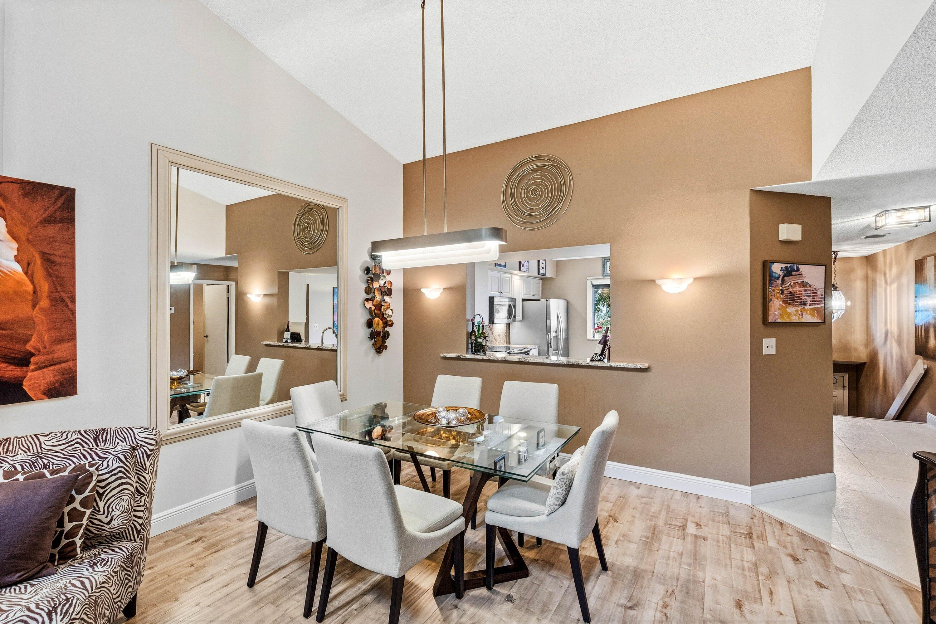 7759 La Mirada Drive Boca Raton, FL 33433 - Photo 13 of 37 a dining room with furniture and wooden floor